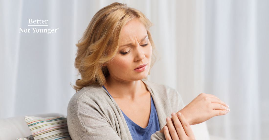 Better not younger features a caucasian woman in her late 30s taking her right hand while having a pain expression as it might be a symptom of menopause.