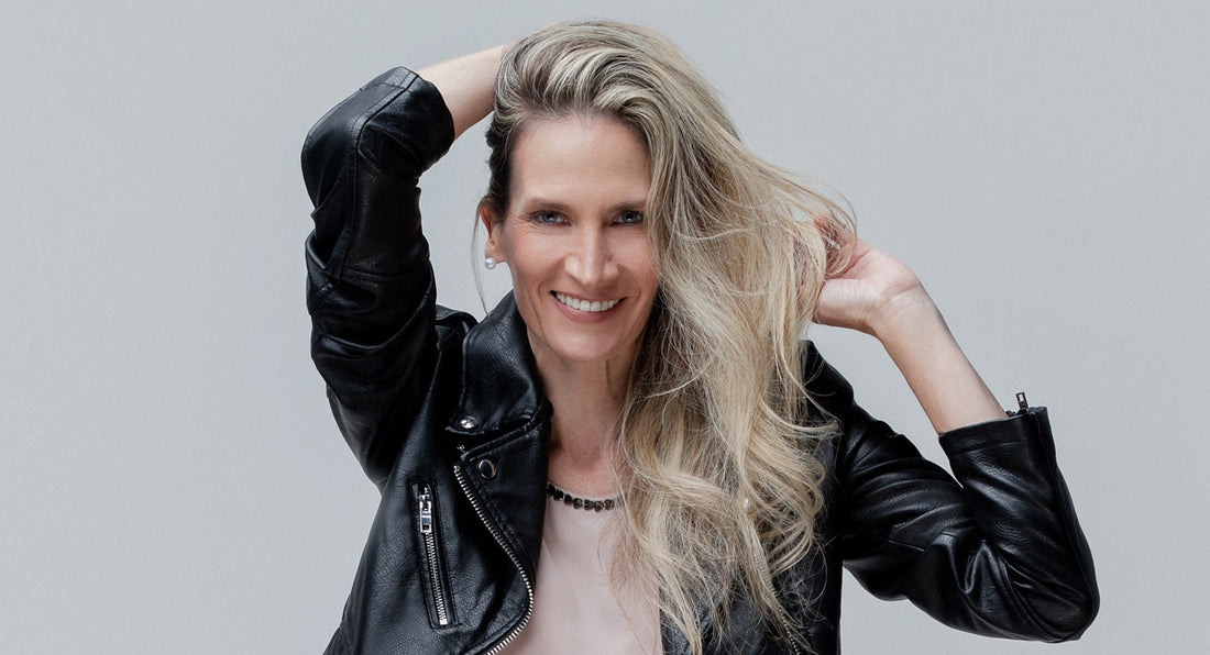 A woman over 40 years old looks happy in the winter do to the results of her hair routine for dryness and itchiness by better not younger