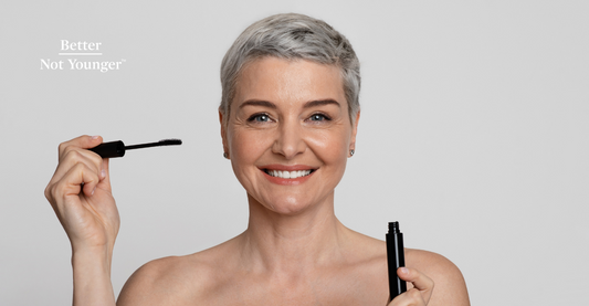 A beautiful mature short haired woman using eyebrow grooming system for aging hair and eyebrows.