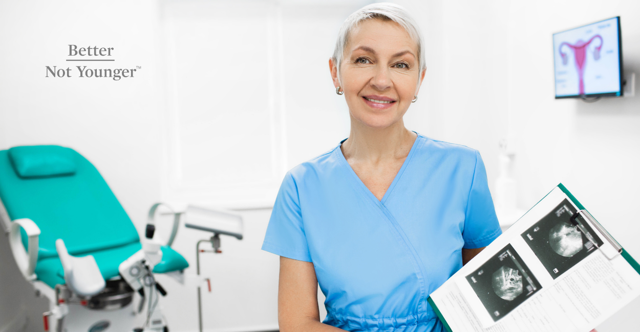 In this article about How Pregnancy and IVF Takes a Toll on Your Hair, BNY features a mature female ginecologist with short gray hair wearing a blue uniform while holding ecosonograms in her consulting room.