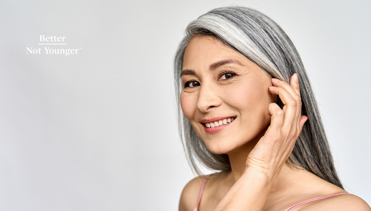A woman with straight long gray shiny healthy hair
