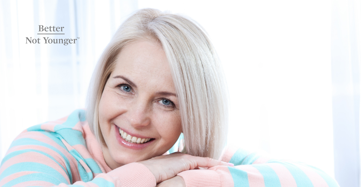 In this article on "How To Sail Through Menopause", BNY features a beautiful woman with short white hair smiling to the camera.