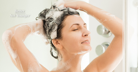 A woman washing her hair with sulfate free shampoo.
