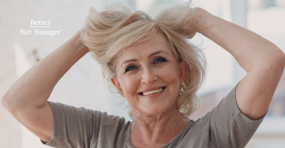 For Rice Water Vs Rice Bran Oil For Hair Explained, Better Not Younger features a mature woman with medium blonde hair holding it while smiling at the camera and looking happy.